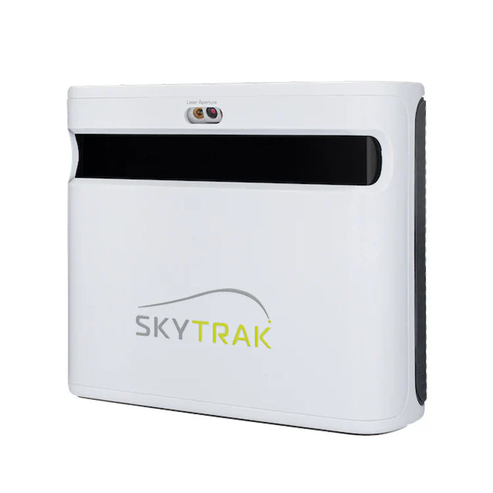 SkyTrak Plus launch monitor positioned beside golf ball during simulator practice
